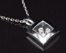 Chopard 'Happy Diamond' necklace, the square glazed compartment containing three collet-set