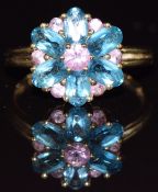 A 9ct gold ring set with pink sapphire and blue topaz in a cluster, 2.4g, size N