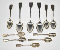 William IV hallmarked silver part canteen of fiddle pattern cutlery comprising three table spoons,