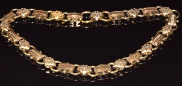 Victorian yellow metal Etruscan Revival necklace made up of circular, diamond shaped and domed