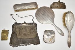 Hallmarked silver dressing table set comprising hand mirror and two brushes, cigarette case,