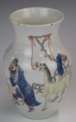 Chinese Kangxi vase decorated with a figure watering two horses, with six character mark to base,