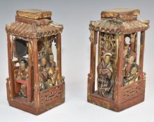 Chinese pair of miniature carved wood pagodas with figures looking out and gilt decoration, probably
