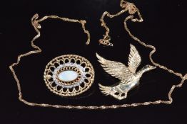 A 9ct gold brooch set with an opal and diamonds, 9ct gold brooch in the form of a duck with a