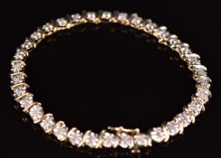 A 9ct gold bracelet set with diamonds totalling approximately 0.9ct, 18cm long, 6.5g