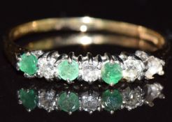An 18ct gold half eternity ring set with diamonds and emeralds, in vintage box, 2.1g, size S