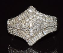 A 9ct white gold ring set with baguette cut and round cut diamonds, 3.6g, size N