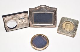 Four various hallmarked silver photograph frames including one example decorated with a horse or