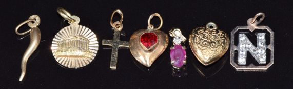 Six 9ct gold pendants including ruby and diamond, hearts, cross and letter N (2.4g) and 14k gold