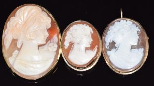 Three 9ct gold brooches/ pendants set with cameos, largest 3 x 3.7cm