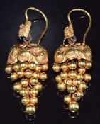 A pair of Victorian earrings in the form of a bunch of grapes made up of spheres and textured