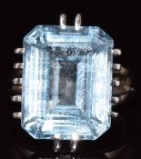 An 18ct gold ring set with an emerald cut topaz measuring 17.9 x 14.1mm, 12.7g, size O