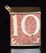 A 9ct gold charm set with a 10 shilling note, 2.3g