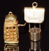 A 9ct gold charm in the form of a telephone box and another 9ct gold charm in the form of a
