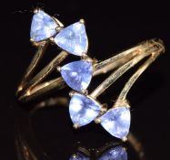 A 9ct gold ring set with five trillion cut tanzanites, 2.9g, size S