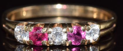 An 18ct gold ring set with diamonds and rubies, 1.7g, size J