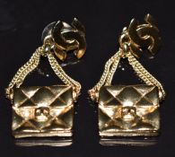 A pair of Chanel earrings in the form of the iconic bag with CC logo, marked Chanel 2002