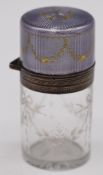 Silver and purple guilloché enamel dressing table bottle with hinged lid and glass stopper, the body