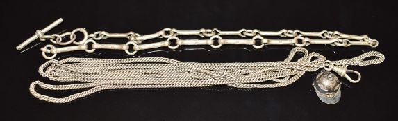 A silver Albert/ watch chain, white metal guard chain, and a silver fob/ charm in the form of a