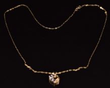 A 9ct gold pendant set with sapphires and diamonds, on 9ct gold chain, 1.2g, 47cm long