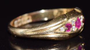 An 18ct gold ring set with rubies and diamonds, London 1915, 3g, size M