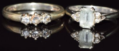 A 9ct gold ring set with an aquamarine and diamonds and a 9ct gold ring set with three diamonds