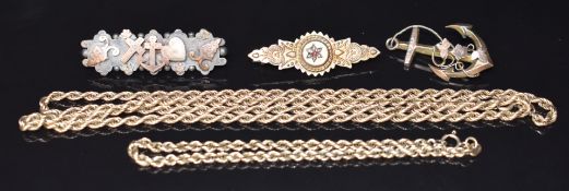 Two Victorian 9ct gold brooches, one in the form of an anchor (3.4g), a silver Victorian brooch with