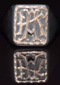 A jet signet ring with gold initials, size H