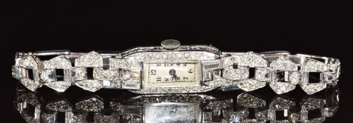 A platinum Art Deco cocktail watch set with baguette and transitional cut diamonds the largest