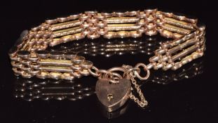 A 9ct rose gold gate bracelet with engraved links and heart padlock clasp, 16.2g, 19cm long