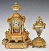 French ormolu mantel clock set with porcelain panels, the two train movement striking on a bell