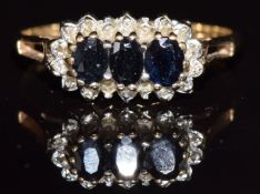 A 9ct gold ring set with sapphires and diamonds, 2g, size O