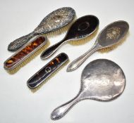 Hallmarked silver dressing table items comprising hand mirror and five various brushes