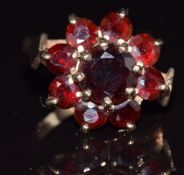 A 9ct gold ring set with a cluster of garnets, 4.5g, size Q
