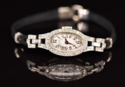 Tiffany & Co Art Deco platinum ladies wristwatch set with diamonds to the engraved case, blued