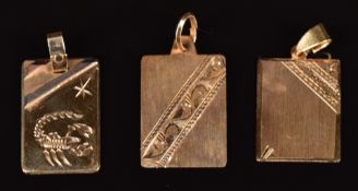 Three 14k gold pendants, one depicting a scorpion, 5.7g