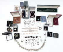 A collection of jewellery including eleven silver rings set with tiger's eye, turquoise, garnets,