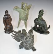 Two bronze figures, one Chinese of a boy riding a water buffalo, the other Tibetan Garuda together