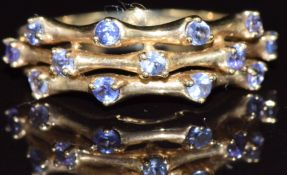 A 9ct gold ring set with tanzanites, 1.6g, size N