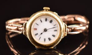 Unnamed 18ct gold wristwatch with blued hands, Roman numerals, white enamel dial and engraved