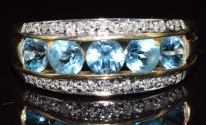 A 9ct gold ring set with topaz and diamonds, 3.7g, size N
