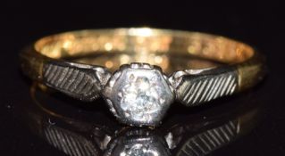 An 18ct gold ring set with a diamond in a platinum setting, 2.1g, size K