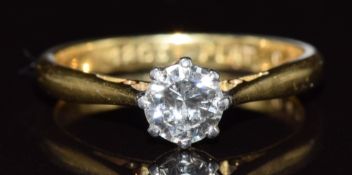 An 18ct gold ring set with a round cut diamond of approximately 0.4ct in a platinum setting, 2.5g,