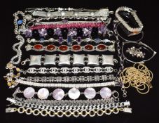 Twenty silver bracelets including tiger's eye, amethyst, mother of pearl, agate, garnets, marcasite,