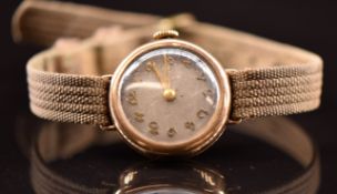 Unnamed 9ct gold ladies wristwatch with gold hands and Arabic numerals, silver dial and 15 jewel