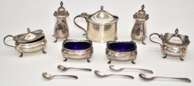 George V hallmarked silver cruet set comprising two open salts, mustard and two peppers, all but