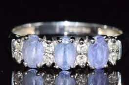 A 9ct white gold ring set with tanzanites and diamonds,1.8g, size L