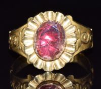 An early 19thC gold ring set with foiled imperial topaz, 4.2g, size P