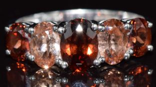 A 9ct white gold ring set with quartz and garnets, 2.4g, size N