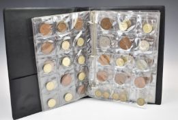 A coin album containing UK and overseas coinage, George III onwards